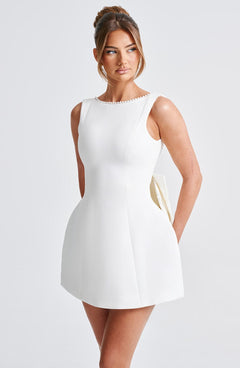 Charlotte - Elegant Pearl Bow Mini Dress