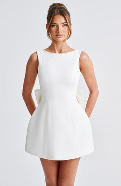 Charlotte - Elegant Pearl Bow Mini Dress
